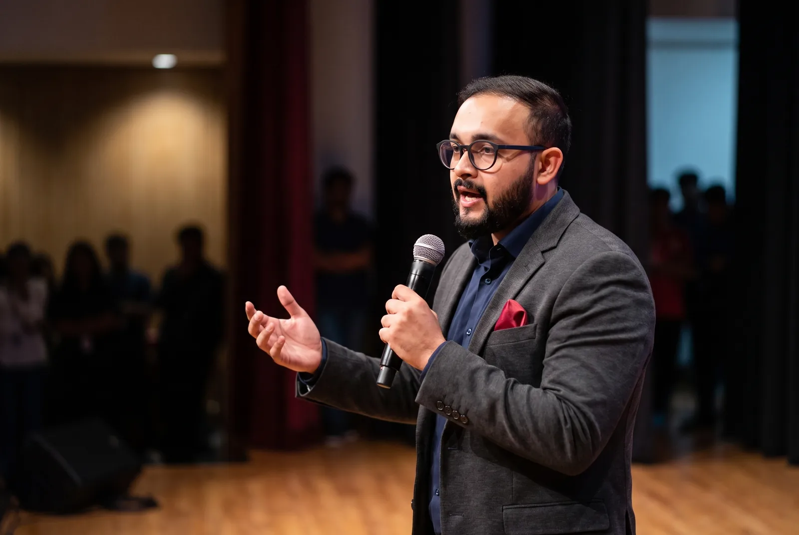Sajal Dubey speaking to a group with a microphone